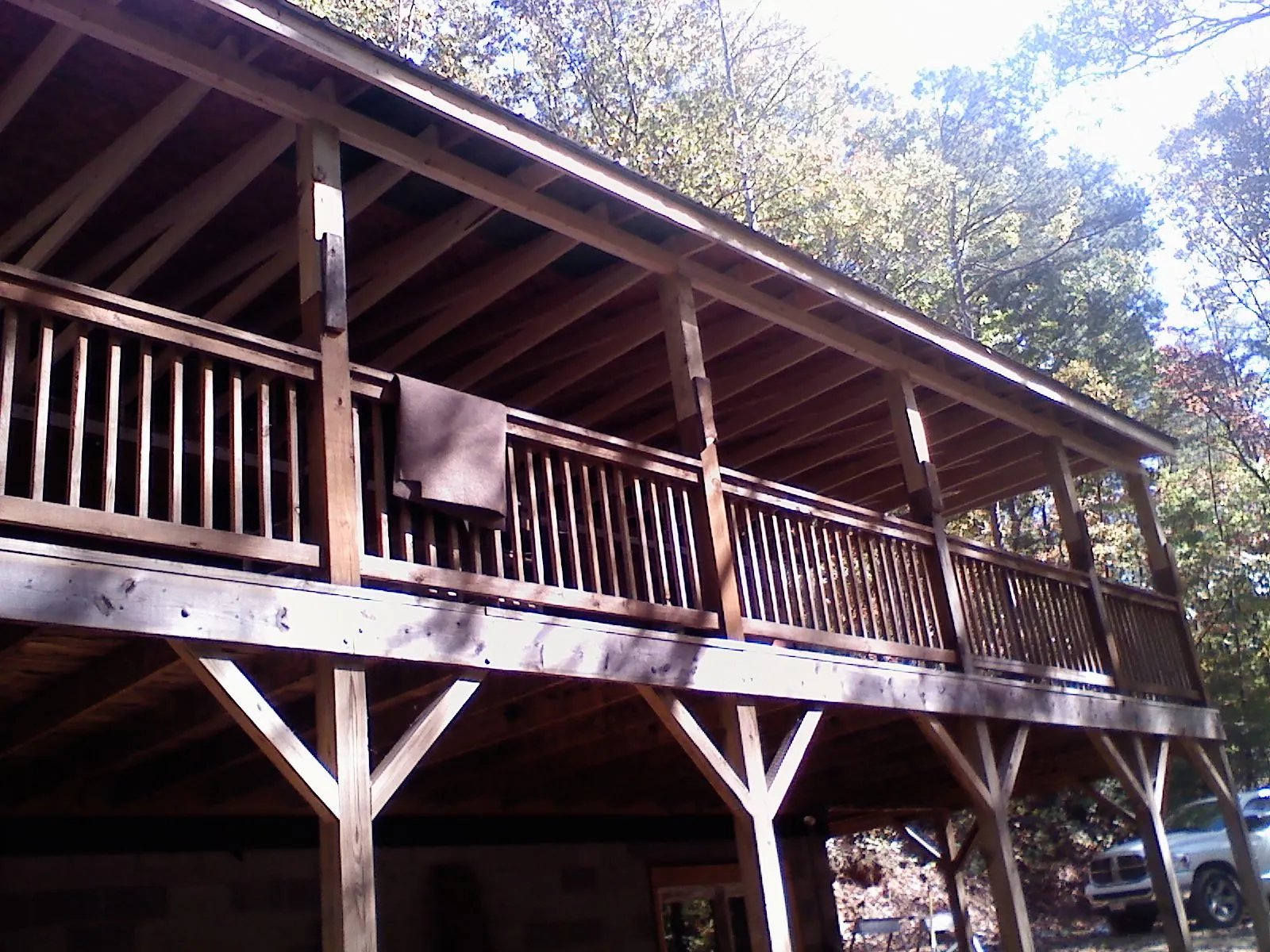 Timber framing under a new elevated porch and deck — Roof Leak Repair in Social Circle by Roofing Brothers
